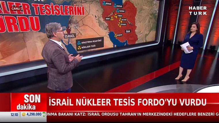 Gürsel Tokmakoğlu at a map of Iran's nuclear sites on Habertürk as Israel strikes Fordow