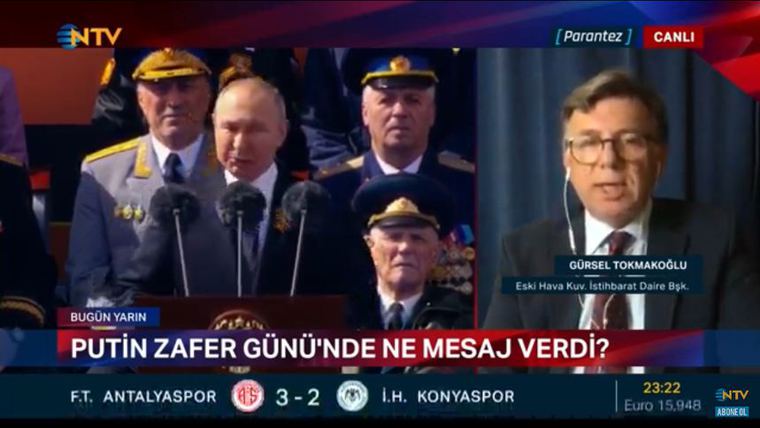 Gürsel Tokmakoğlu on NTV, captioned as former Head of Air Force Intelligence, beside Putin at the Victory Day parade